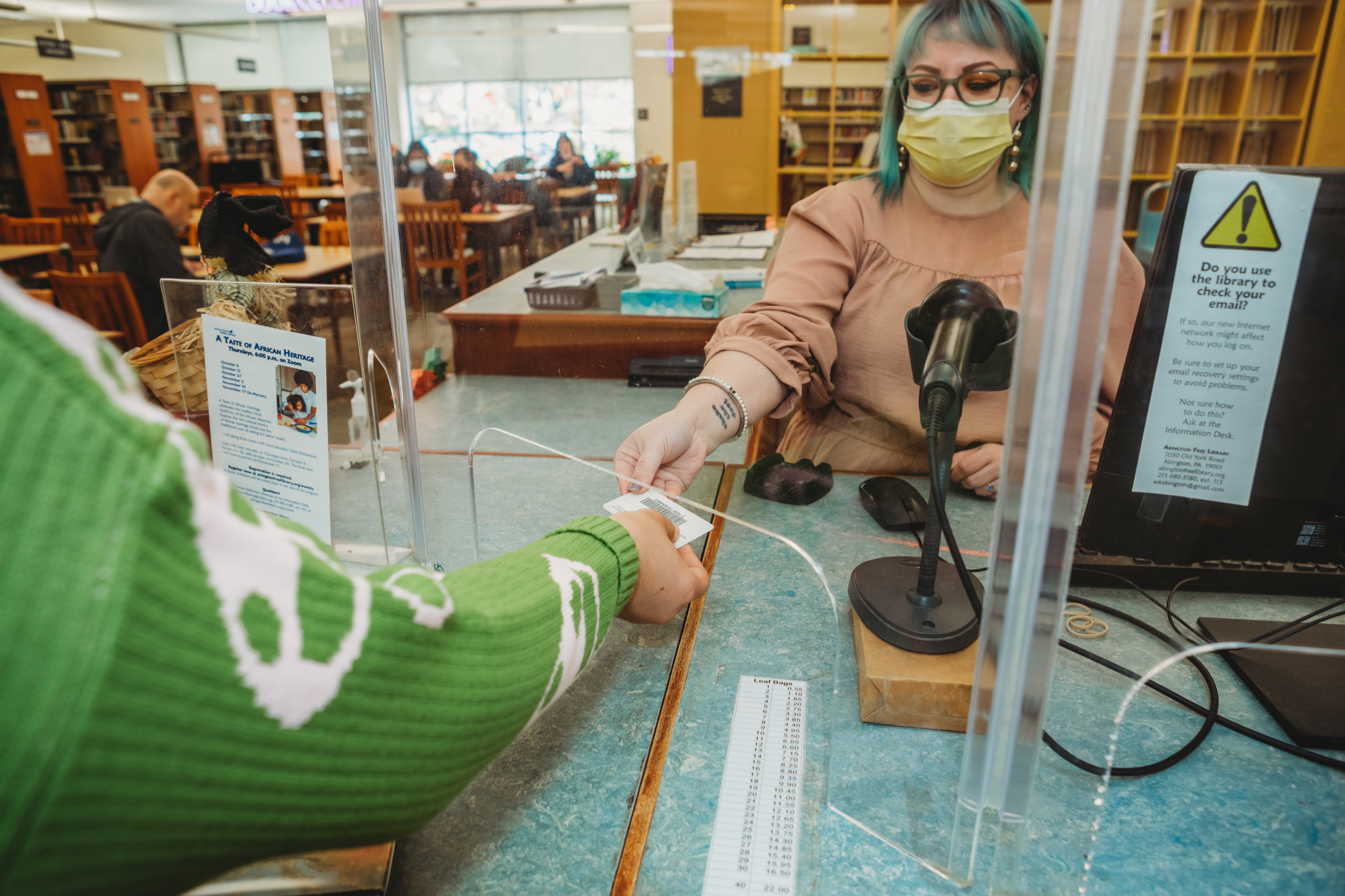 Sara working at the Circulation Desk